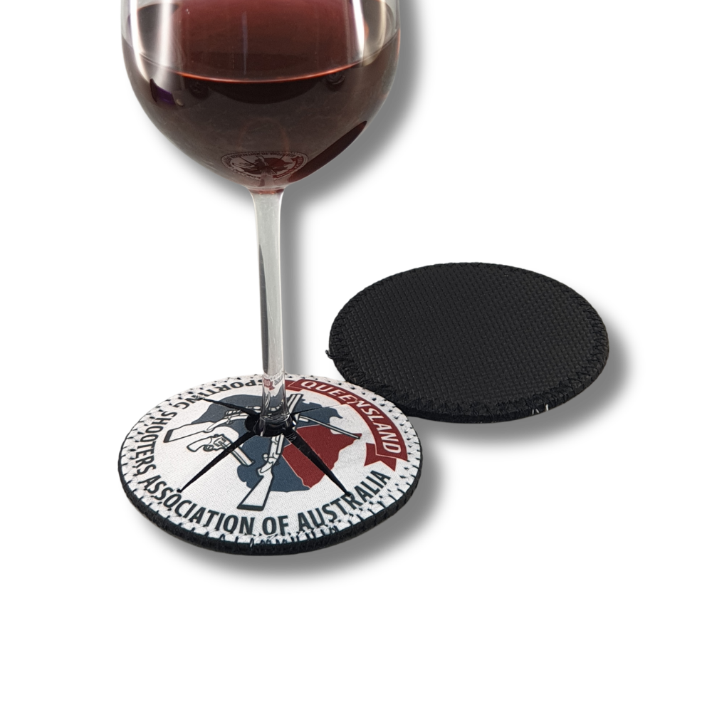 branded-neoprene-wine-glass-shoe-drink-coaster-queensland-association Custom printed neoprene wine glass shoe coaster fitted around a wine glass stem, featuring Queensland Sporting Shooters Association branding.